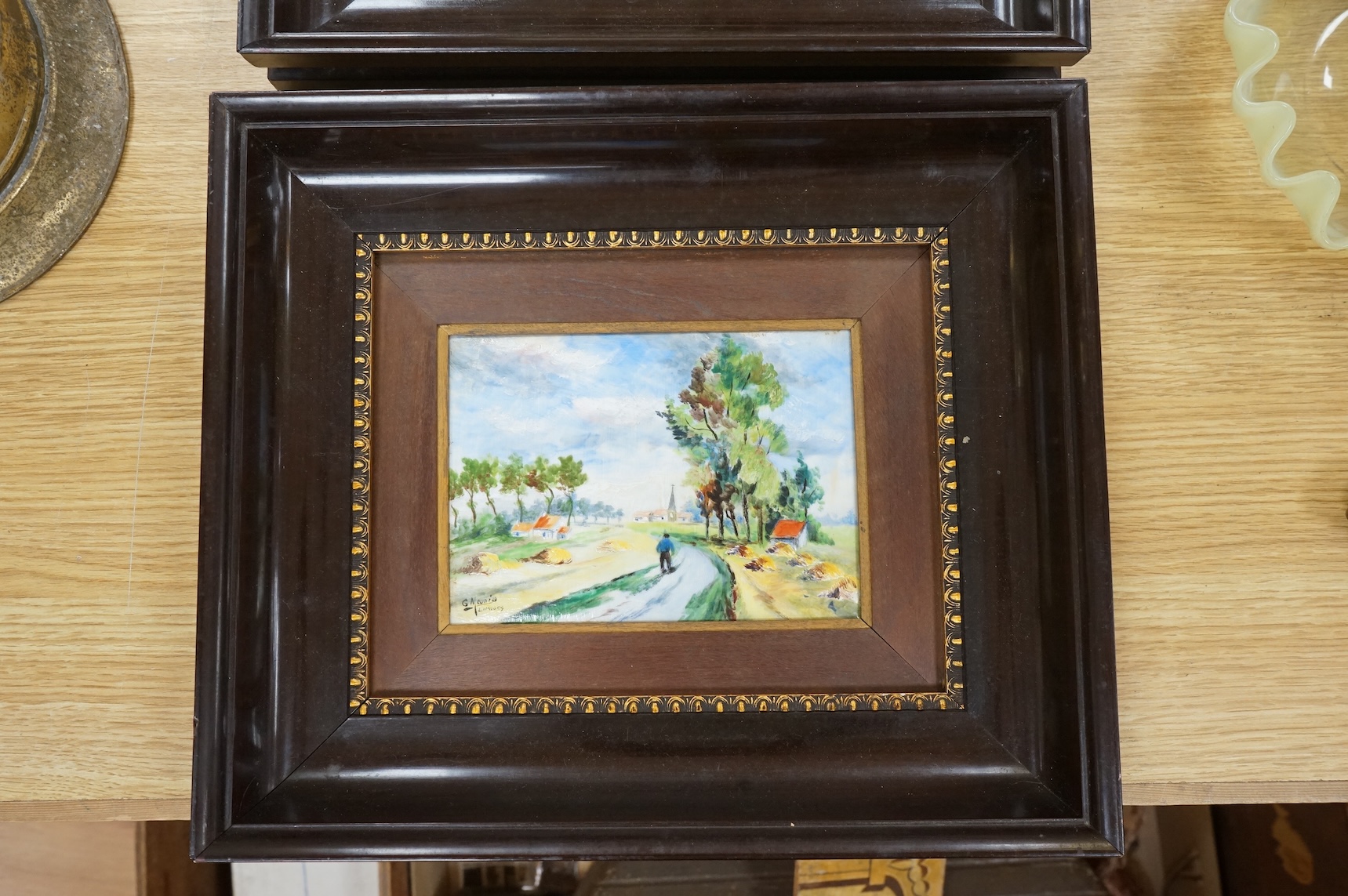 A pair of Limoges porcelain plaques depicting landscapes, signed G Meunier, framed, 30 x 35cm